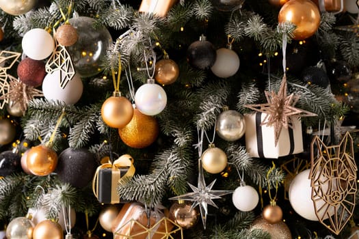Christmas tree decoration close up background. Garland, balls, illuminated lights