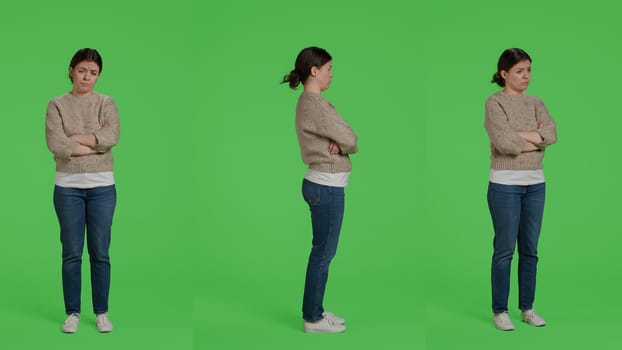 Displeased person acting sad and discouraged posing over isolated greenscreen