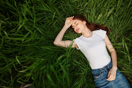 carefree woman spends day lying in tall grass