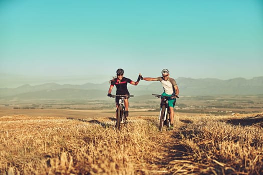 Cyclist make better lovers. two cyclists out cycling in the countryside.