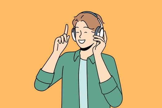 Smiling man in headphones listen to music