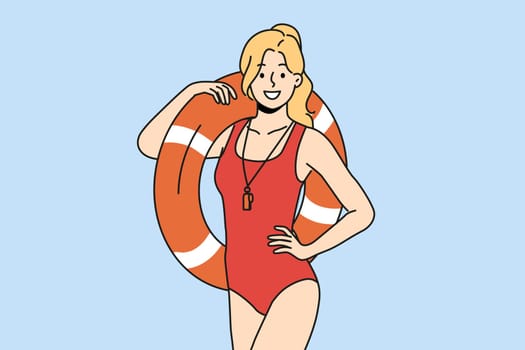 Smiling lifeguard with inflatable ring in hands