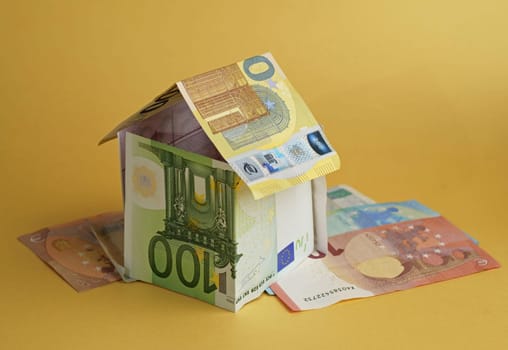 house built from banknotes House made from euro banknotes concept for real estate prices, mortgages or home financing