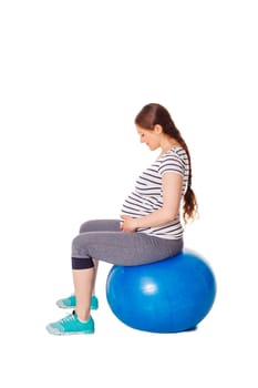 Pregnant woman doing exercises with exercise ball