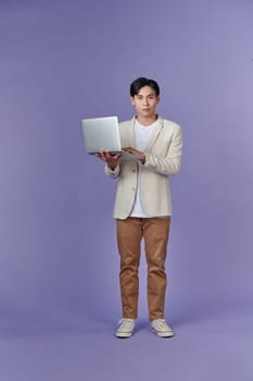 Young Asian business man using laptop computer