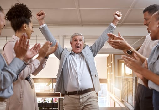 Business people, celebration and winning with applause for promotion, success or teamwork at office. Happy senior businessman in joy for win, victory or achievement with team clapping at workplace.