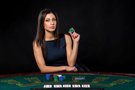 sexy woman with poker cards and chips