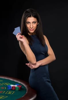 sexy woman with poker cards and chips