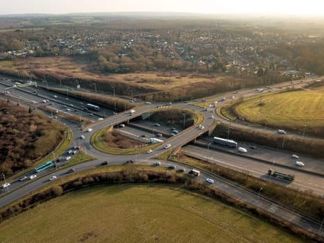 UK M25 Motorway Junction Sunset Aerial View at Rush Hour