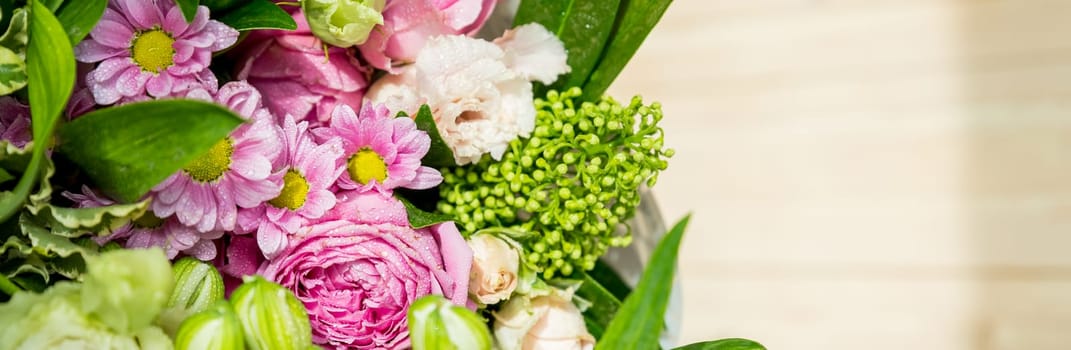 bouquet of roses, daisies, lisianthus, chrysanthemums, unopened buds on blurred background. Present. Mothers day, teachers day, holidays, web banner