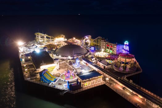 The Theme Park at the End of Brighton Palace Pier Illuminated at Night