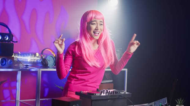 Dj artist using professional mixer console in nightclub