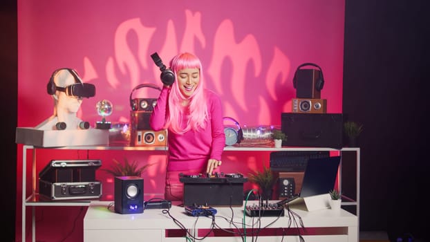 Artist standing at dj table performing electronic song