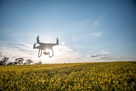 A Drone Flying Over Farmland Photographing and Surveying