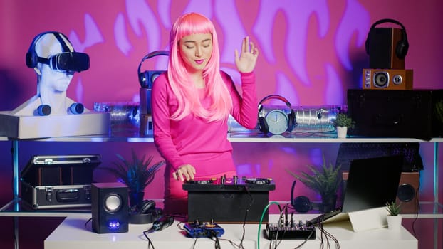Artist with pink hair dancing and having fun in nightclub