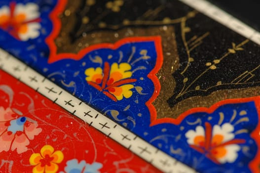 A closeup of a colorful artistic painting on a box. Central Asia, Uzbekistan