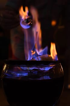 Fire tongs punch in glass bowl. Feuerzangenbowle, Germany