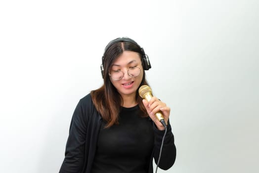 Woman (LGBTQ) singer sing a song with microphone