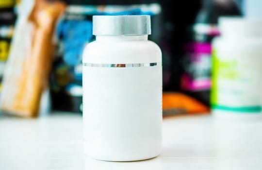 White can of vitamins without label