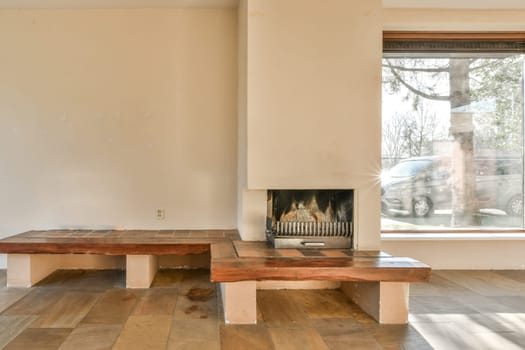 a living room with a fireplace and a wooden bench