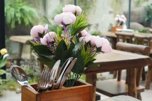 blur cafe background with flower on table ,
