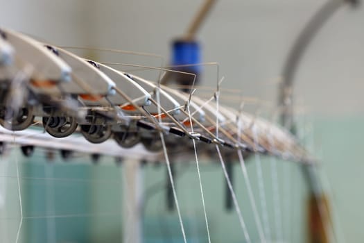Image thread in holders on loom