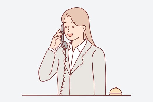 Receptionist woman talking on phone answering customer call with request to send maid or waiter