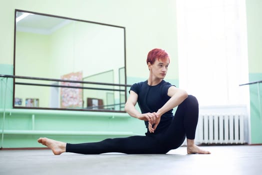 Female dancer stretching before choreography practice