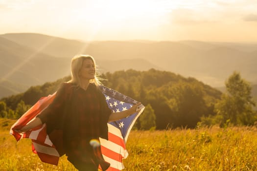 young beautiful woman holding USA flag.