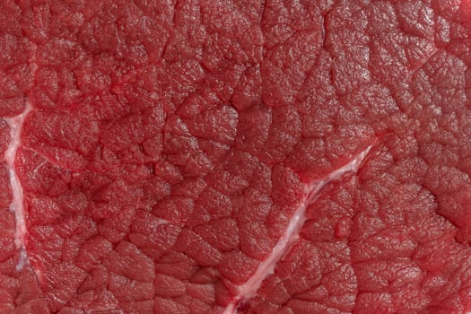 Texture of a red piece of beef, macro
