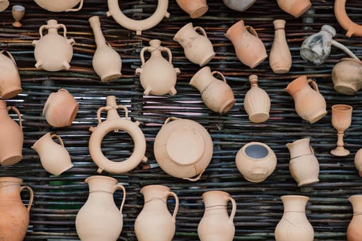 Ceramic clay terracotta jug, pot, vase, kitchen souvenirs in a handmade ceramics street store.