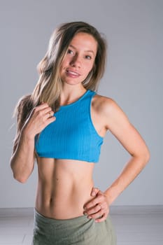 Portrait of young slim fitness woman. Sport and healthy lifestyle concept.