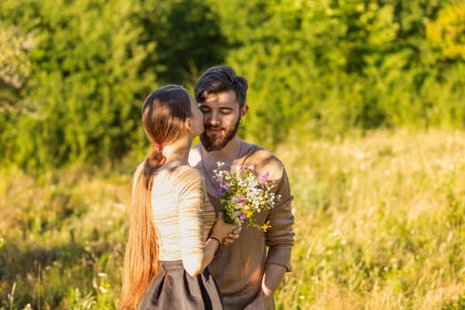 man giving flowers to his girlfriend