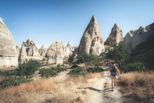 Tourist going to cave dwellings in Cappadocia