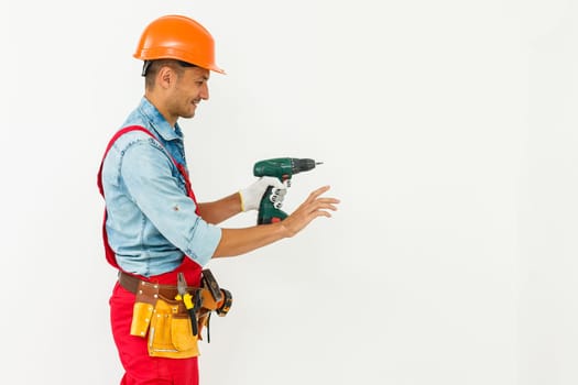 Construction worker with helmet and screwdriver