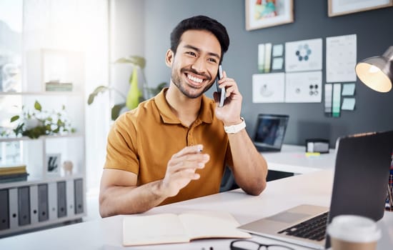 Phone call, smile and planning with a business man chatting while working at his desk in the office. Mobile, contact and communication with a young male employee chatting or networking for strategy.
