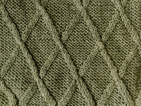 Handmade knit material with macro woven threads.