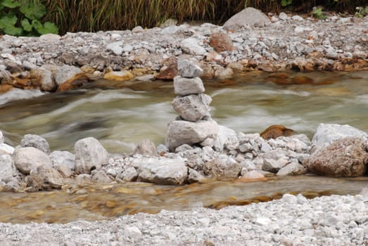 Stones stacked in a river in Berchtesgaden, Bavaria, Germany