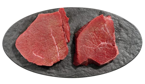 Round raw beef steak on a white isolated background