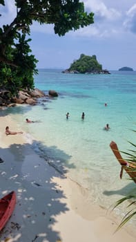 Koh Lipe Island Southern Thailand April 2023, tourists relaxing in the ocean during the heat wave in Thailand