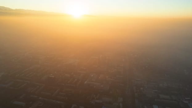 Epic gray smog is visible at sunset over the city