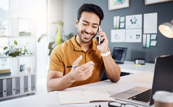 Phone call, happy and strategy with a business man chatting while working at his desk in the office. Mobile, contact and communication with a young male employee chatting or networking for planning.