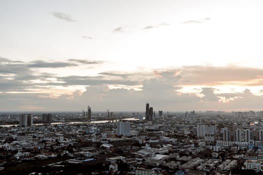 Gorgeous scenic of the sunset with cloud on the sky over large metropolitan city in Bangkok. 