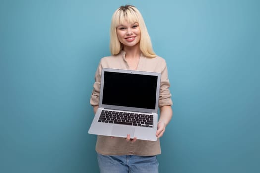 blond young woman freelancer with laptop computer