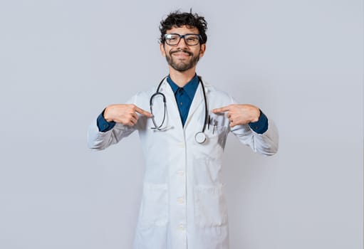 Smiling doctor pointing at himself isolated. Satisfied doctor pointing at himself.