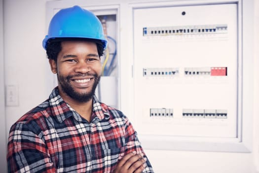 Black man in portrait, technician and electricity fuse box, check power supply with maintenance on main circuit breaker. Engineer, electrician and male worker with smile, handyman and electrical fix