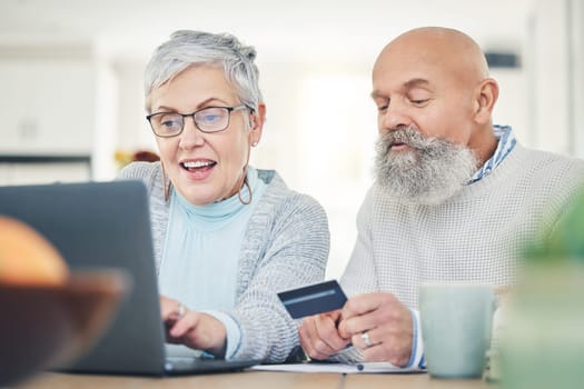 Laptop, senior couple and credit card in home for online shopping, digital banking or payment. Computer, ecommerce and happiness of man and woman on internet for sales, retirement finance or fintech.