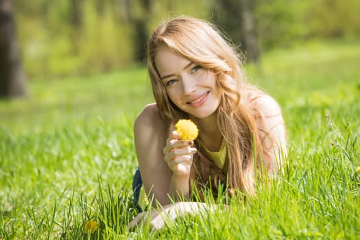 Young smiling woman on grass