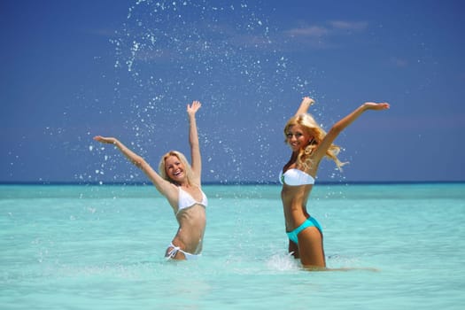 Two girls playing in water