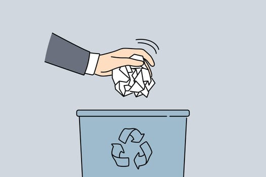Man throw paper in trash bin